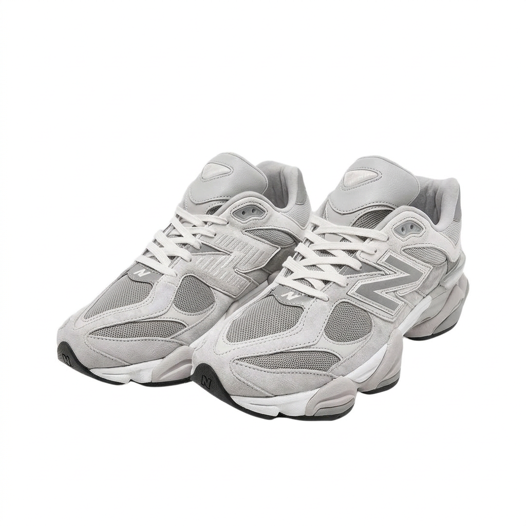 New Balance 9060 grey and white sneakers, three-quarter pair view on white