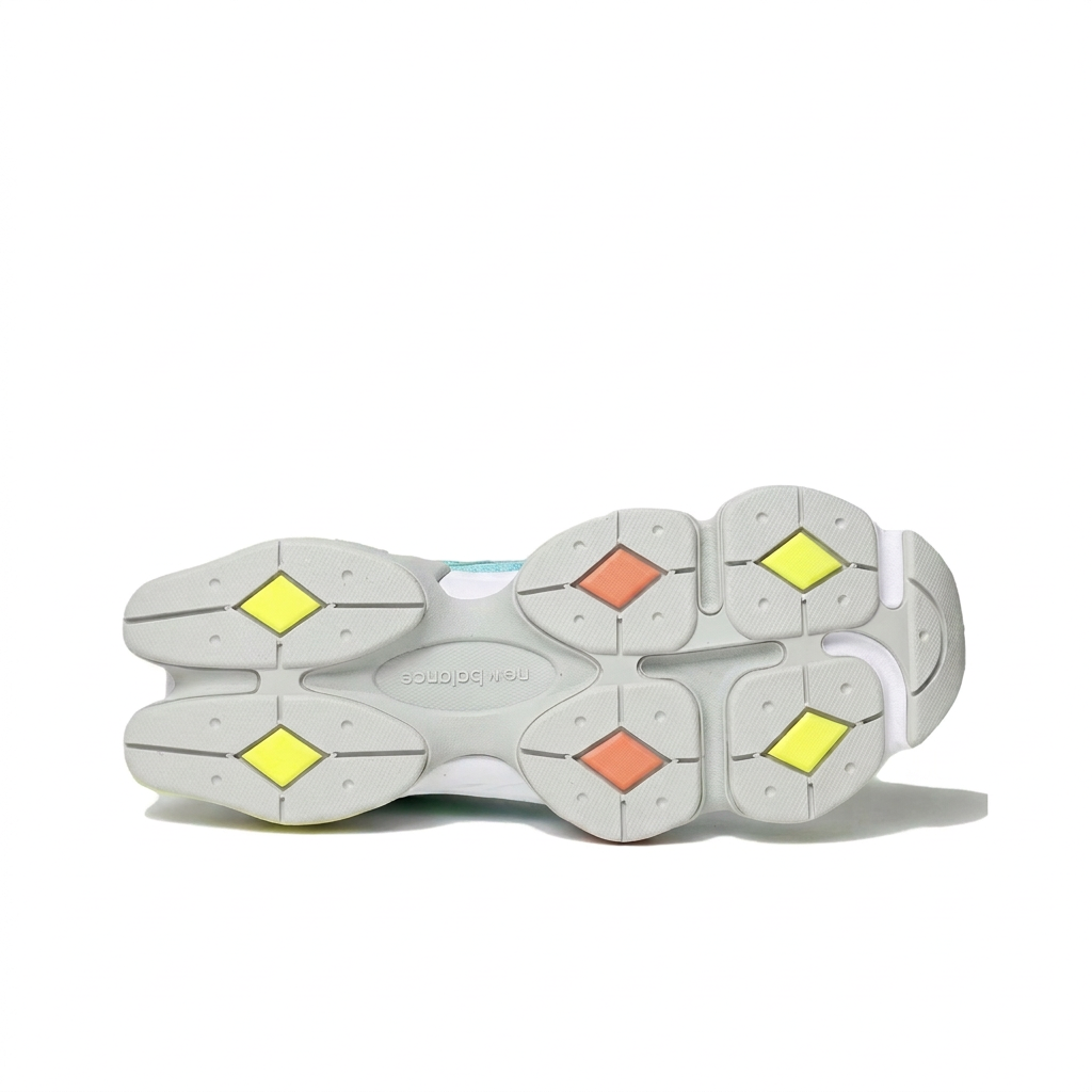 New Balance 9060 mint green white outsole with neon yellow and coral accents on white background