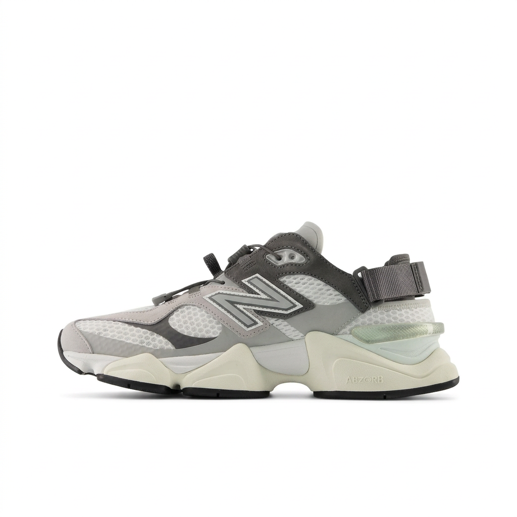 New Balance 9060 grey and cream sneaker, left-facing side view with cord lacing and heel strap on white